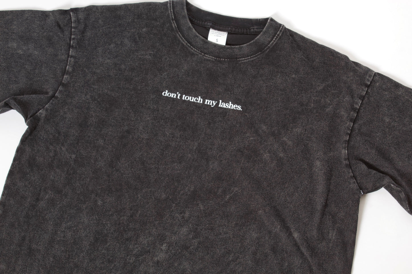 “don’t touch my lashes.” Acid wash tee